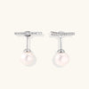 Rhodium-plated sterling silver ear jacket earrings with diamond-set horizontal bar and freshwater pearl drop