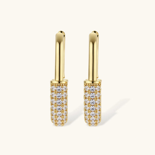 Gold-plated huggie hoop earrings with pavΓ© zirconia stones covering the bottom curve, shown in open and closed positions.