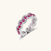 Ornate adjustable ring with pink cubic zirconia stones in white gold-plated copper setting with floral metalwork details