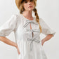 MAD3189 Embroidered Bow Tie Babydoll Dress