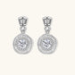 Art Deco-inspired sterling silver drop earrings with tiered moissanite stones in geometric sunburst design