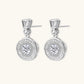 Art Deco-inspired sterling silver drop earrings with tiered moissanite stones in geometric sunburst design