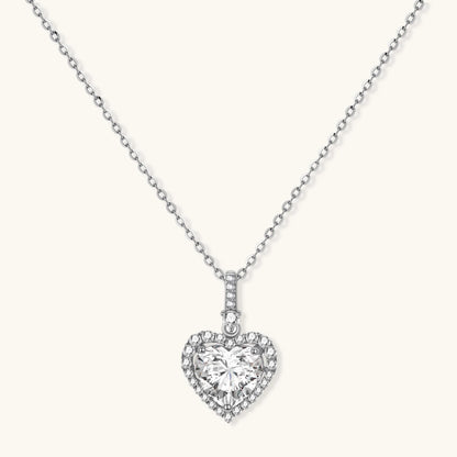 Sterling silver heart pendant necklace with brilliant moissanite center stone and halo setting on delicate chain