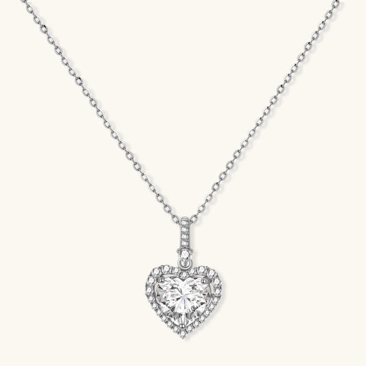 Sterling silver heart pendant necklace with brilliant moissanite center stone and halo setting on delicate chain