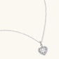 Sterling silver heart pendant necklace with brilliant moissanite center stone and halo setting on delicate chain