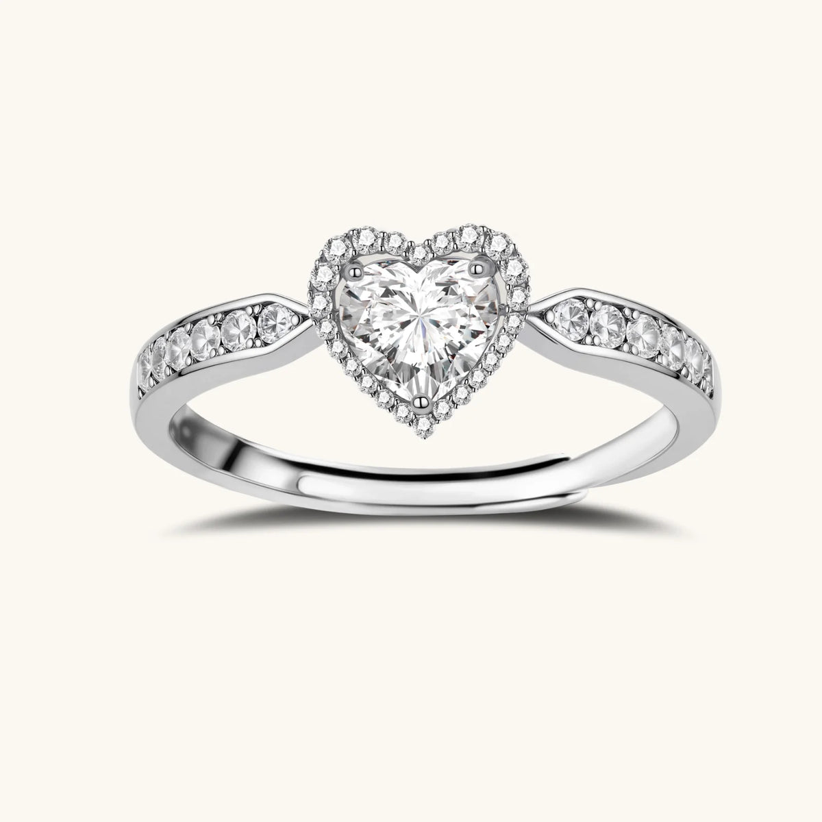 Complete jewelry set with heart-shaped sterling silver pieces featuring brilliant moissanite stones on white background.