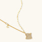 Gold-plated wavy jewelry set with crystal detailing featuring necklace with dual chains and matching textured earrings