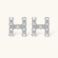 Letter H jewelry set featuring geometric crystal design in gold and white gold plated finish with adjustable chain necklace
