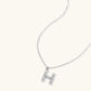 Letter H jewelry set featuring geometric crystal design in gold and white gold plated finish with adjustable chain necklace