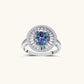 Close-up of sterling silver halo ring with round rainbow moissanite center stone surrounded by baguette-cut stones