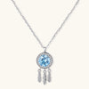 Sterling silver dreamcatcher pendant with blue moissanite center and three feather charms on adjustable chain.