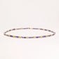 Delicate 18K gold vermeil necklace with alternating lavender zirconia beads and white freshwater pearls on cream background
