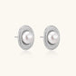 Elegant stud earrings with cream freshwater pearls surrounded by sparkly pavé crystals on rhodium-plated silver setting