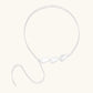Minimalist sterling silver necklace with three brushed leaf-shaped pendants on delicate chain against white background