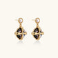 Gold-plated drop earrings with iridescent abalone shell and pearl studs in geometric cross design