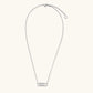 White gold plated necklace with dual-frame geometric pendant featuring crystal pavé border on pale background.