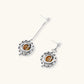 Complete jewelry set featuring citrine stone chips, silver beads, and cosmic circle pendants on cream background.