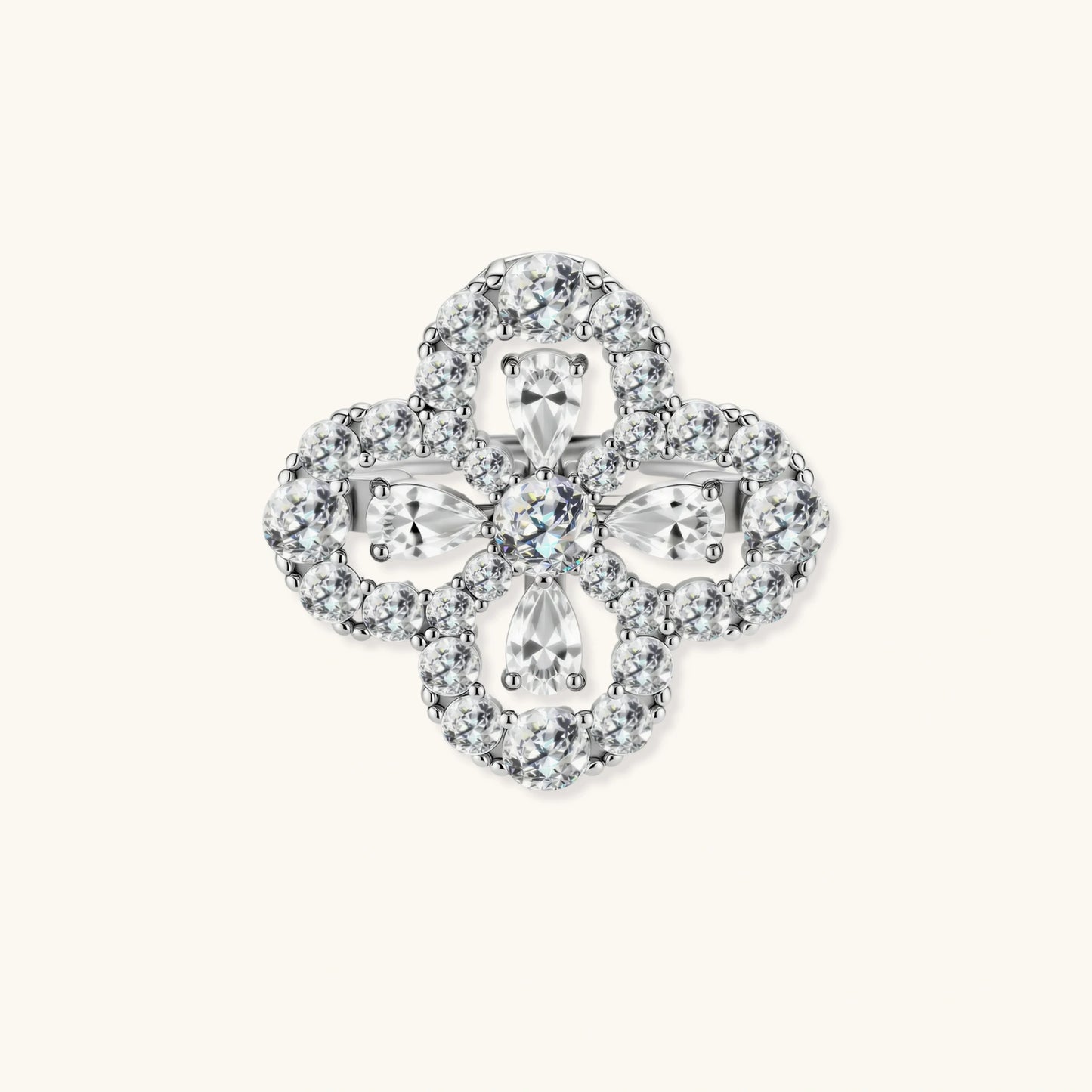 Adjustable sterling silver ring with quatrefoil design featuring brilliant moissanite stones in clover pattern