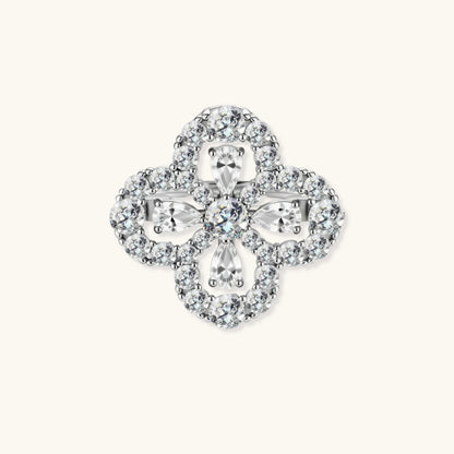 Adjustable sterling silver ring with quatrefoil design featuring brilliant moissanite stones in clover pattern