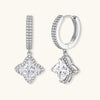 Sterling silver huggie hoops with geometric diamond-shaped moissanite dangles featuring pavé crystal details