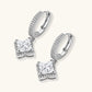 Sterling silver huggie hoops with geometric diamond-shaped moissanite dangles featuring pavé crystal details