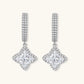 Sterling silver huggie hoops with geometric diamond-shaped moissanite dangles featuring pavé crystal details
