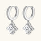Sterling silver huggie hoops with geometric diamond-shaped moissanite dangles featuring pavé crystal details