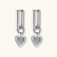Platinum-plated 925 sterling silver rectangular hoop earrings with twisted ring connector and ribbed heart charm pendant.