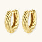 14K gold-plated twisted rope huggie hoop earrings with hinged closure on white background, showing textured surface detail