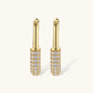 Gold-plated huggie hoop earrings with pavé zirconia stones covering the bottom curve, shown in open and closed positions.