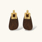 Elegant drop earrings featuring intricate 18k gold plated copper metalwork with dark brown wooden teardrop pendants