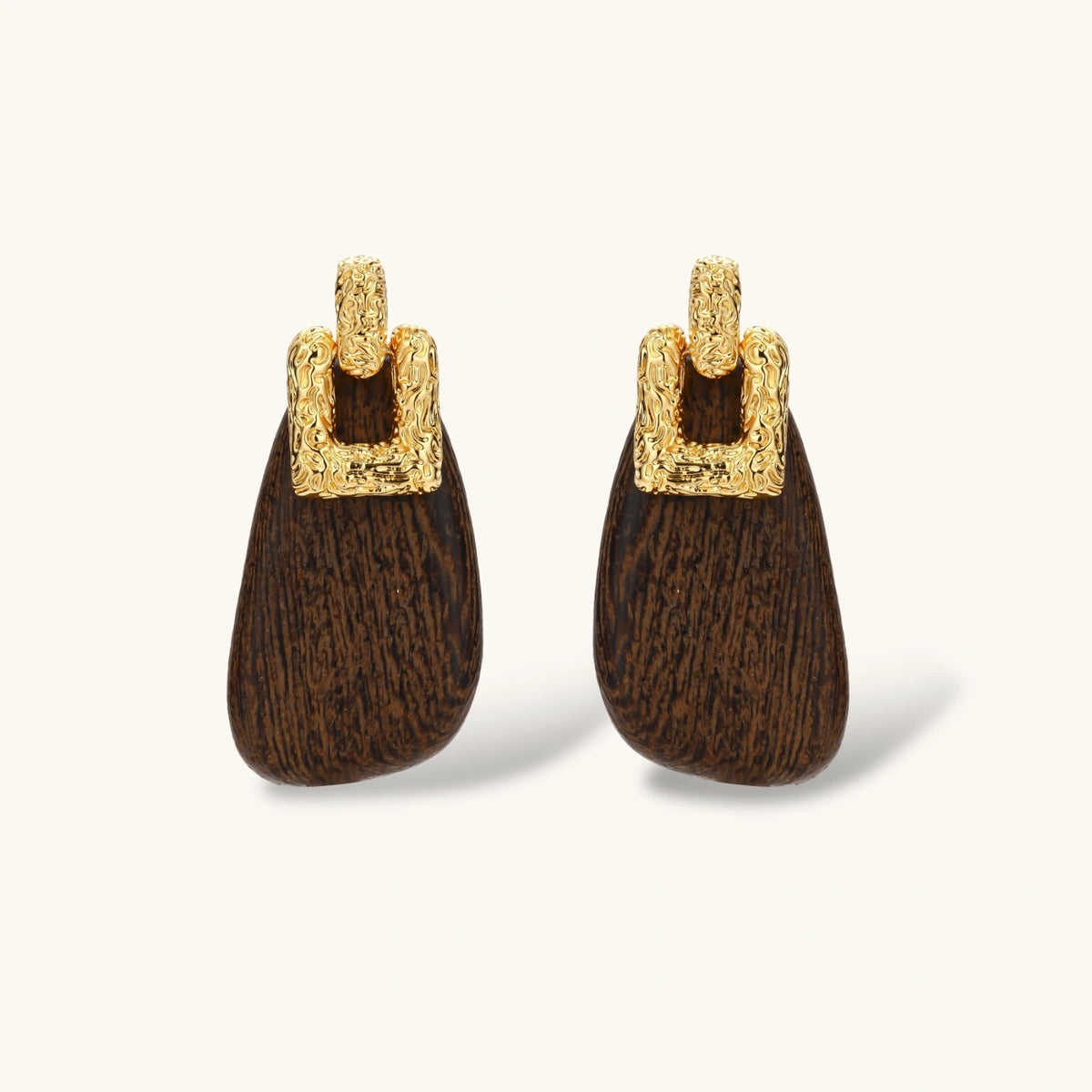 Elegant drop earrings featuring intricate 18k gold plated copper metalwork with dark brown wooden teardrop pendants