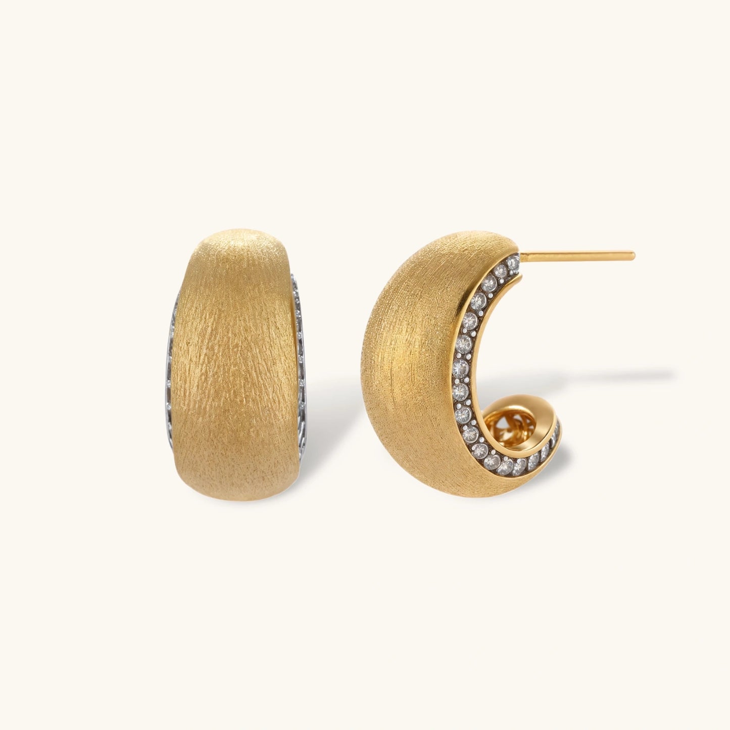Small gold-plated hoop earrings with crystal accents and brushed finish on white background.